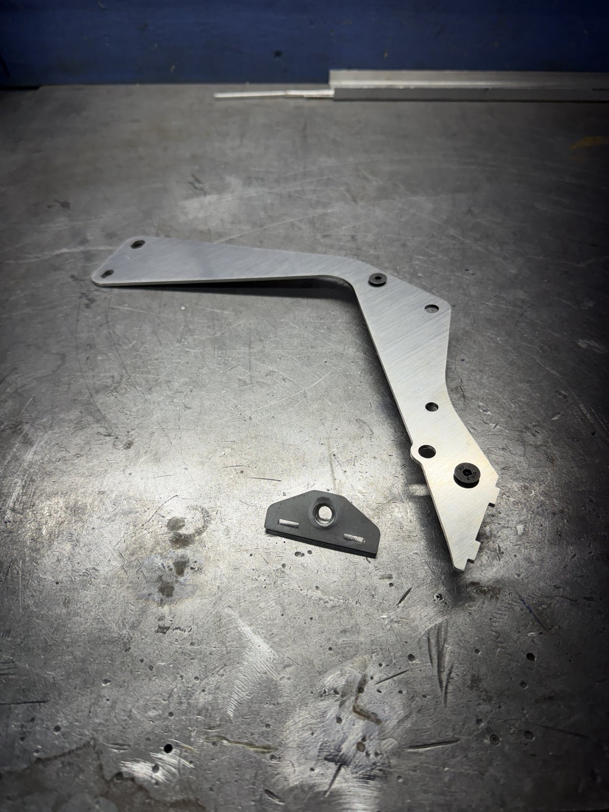Prototype bracket and mounting tab on the shop bench
