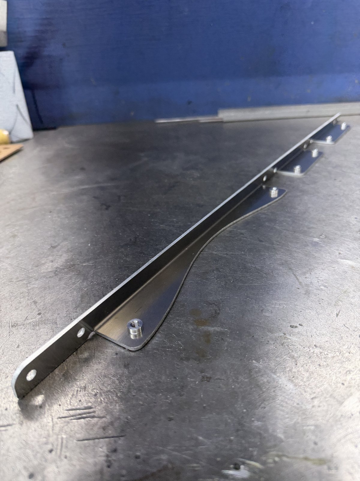 Prototype rail bracket with mounting studs